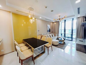 Deluxe Apartment, 2 Bedrooms, Balcony, City View | Living area | 32-inch Smart TV with cable channels, pay movies - Vinhome Central Park - ADVANTAGE HOME (Ho Chi Minh City)