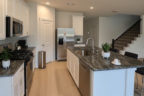 Fridge, microwave, dishwasher, coffee/tea maker