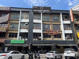 A multi-story building with a prominent sign for Havona Hotel.