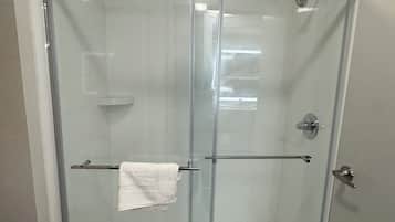 Shower, towels, soap, toilet paper