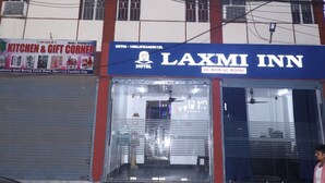 A hotel named LAXMI INN with a sign indicating AC non-AC rooms. - Hotel Laxmi Inn (Patna)
