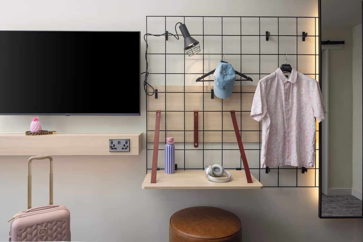 Desk, blackout drapes, soundproofing, free cribs/infant beds