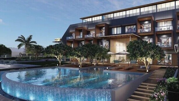 A modern hotel with a large pool, outdoor seating, and a well-maintained garden. - Floating deck resort  (Bhuj)
