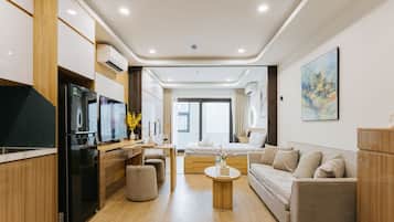 Exclusive Double Room, Balcony | Living area | Flat-screen TV, printers