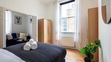 1 bedroom, desk, iron/ironing board, travel crib