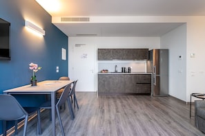 Fridge, stovetop, dishwasher, coffee/tea maker