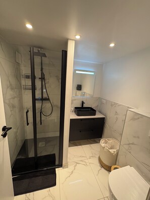 Shower, hair dryer, towels, soap