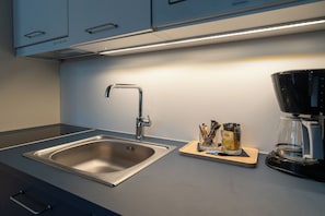 Suite familiar, vistes a la ciutat | Cuina privada | Bullidora elèctrica