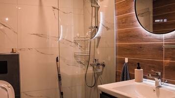 Shower, hair dryer, towels, soap