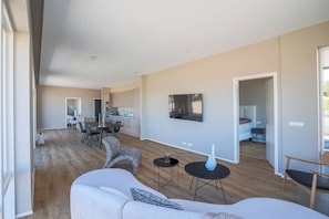 Luxury Apartment, Balcony | Living area | 32-inch LCD TV with cable channels - Hofsbót Luxury apartment (Akureyri)