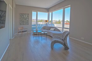 Luxury Apartment, Balcony | Living area | 32-inch LCD TV with cable channels - Hofsbót Luxury apartment (Akureyri)