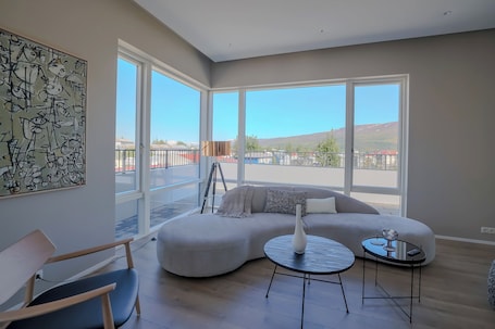 Luxury Apartment, Balcony | Living area | 32-inch LCD TV with cable channels