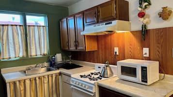 Fridge, microwave, stovetop, cookware/dishes/utensils