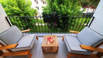 Premium bedding, desk, laptop workspace, blackout drapes