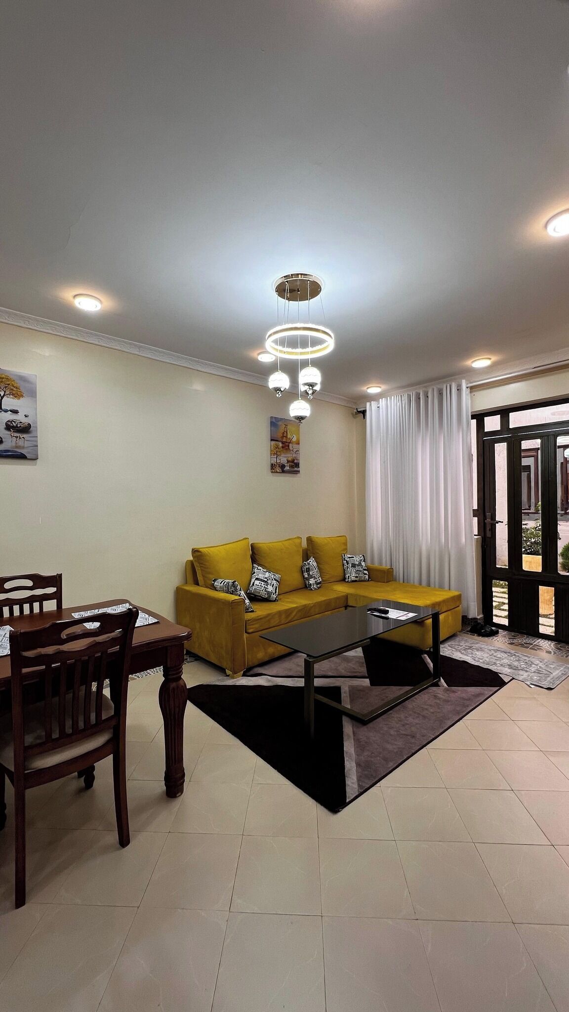 Family Apartment, City View | Living area | 24-inch Smart TV with digital channels