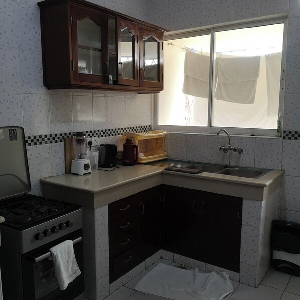 Deluxe Apartment, City View | Private kitchen | Fridge, microwave, cookware/dishes/utensils