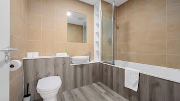 Shower, hair dryer, towels, shampoo