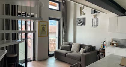 Open-plan loft overlooking Lake Como with private parking space
