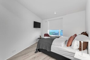 1 bedroom, desk, iron/ironing board, travel cot