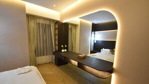A modern hotel room with a bed, a bench, a bedside table, and a mirror. - Highend Luxury Rimal with JBR view (Dubai)