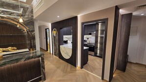 A modern kitchen with a built-in oven and a stainless steel refrigerator. - Highend Luxury Rimal with JBR view (Dubai)