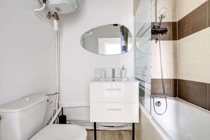 Shower, hair dryer, towels, shampoo