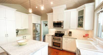 Newly Offered: Sandy Beach Kayaks SUPs Canoes Firepit Beautiful Indoor Spaces