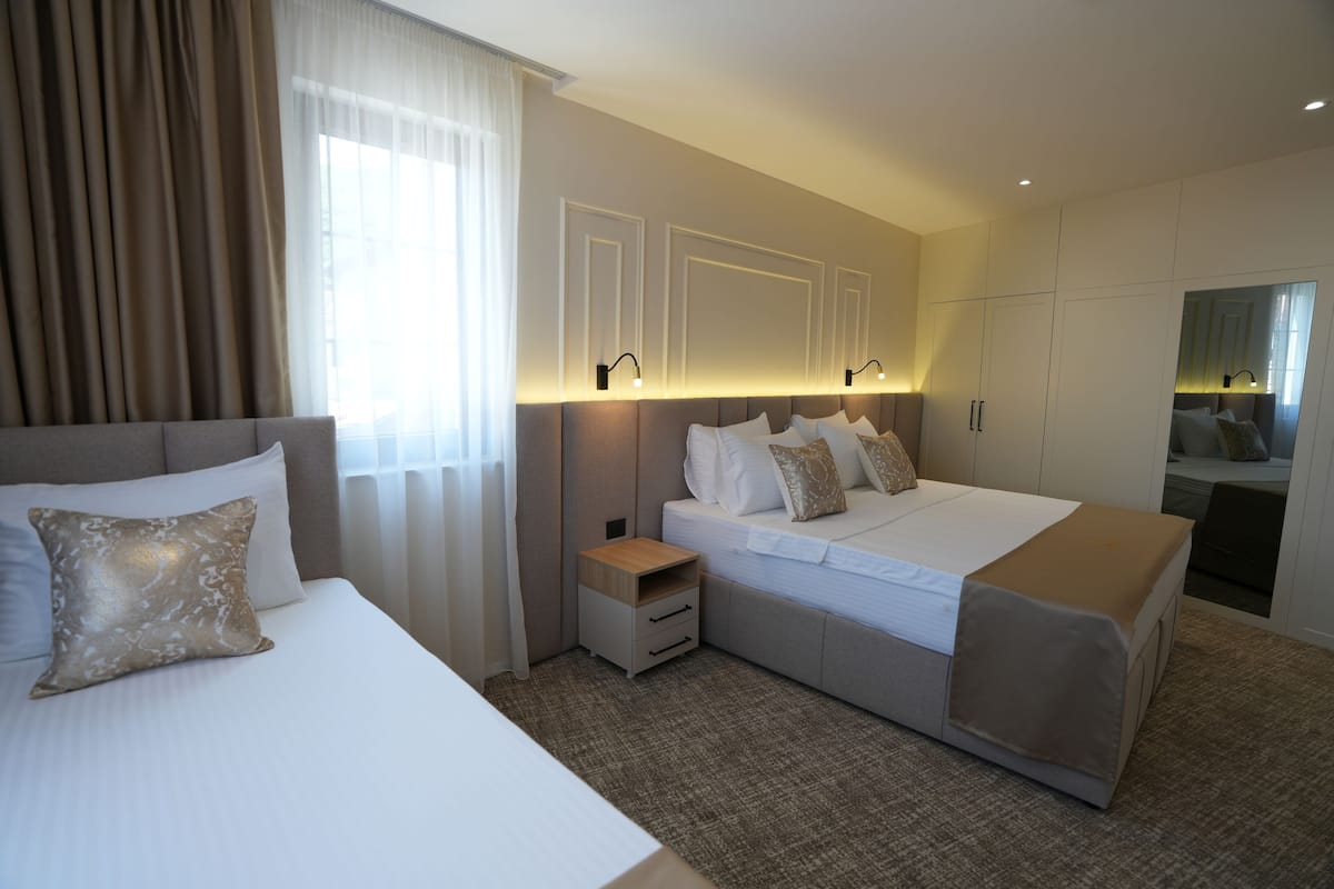 Family Triple Room, City View | Minibar, individually decorated, individually furnished, desk