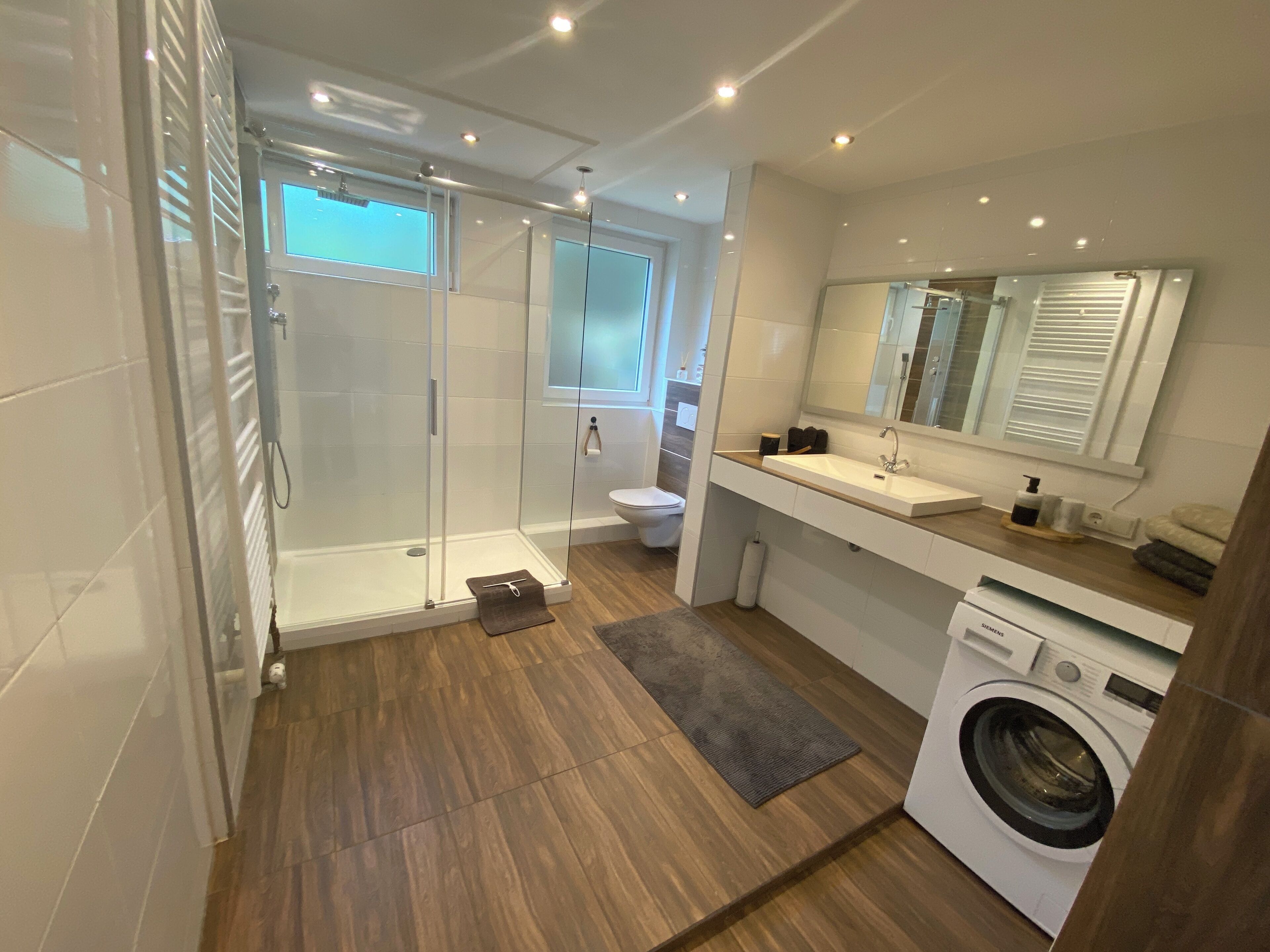 Shower, towels, soap, toilet paper