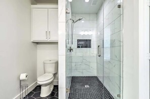 Shower, hair dryer, towels, shampoo