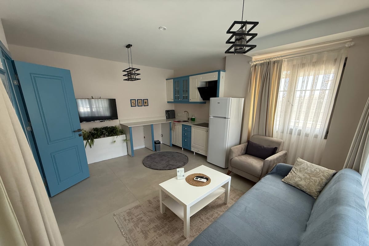 Apartment, Balcony, Pool View | Living area