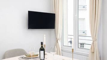 Standard Apartment, Courtyard View | Living area | 80-cm Smart TV with digital channels