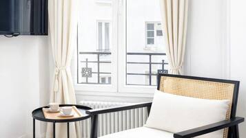 Standard Apartment, Courtyard View | Living area | 80-cm Smart TV with digital channels