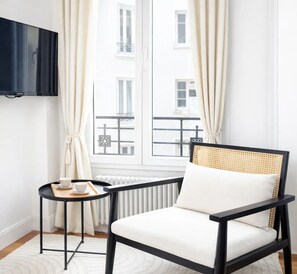 Standard Apartment, Courtyard View | Living area | 80-cm Smart TV with digital channels - 1611 Vouillé (Paris)