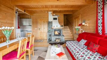 Deluxe Chalet, Mountain View | Living area | Smart TV, fireplace