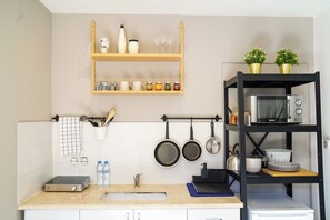 Fridge, microwave, stovetop, coffee/tea maker