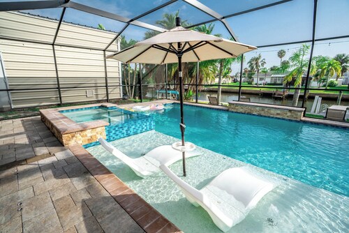 Resort-Style Canal Home w/ Pool & Putting Green - Baywatch