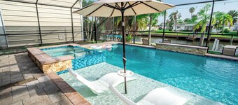 Resort-Style Canal Home w/ Pool & Putting Green - Baywatch