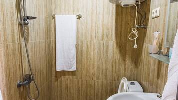 Shower, hair dryer, slippers, towels