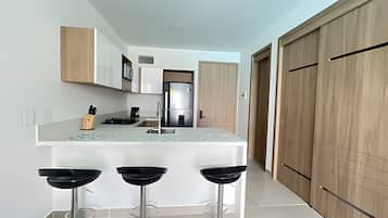 Fridge, oven, coffee/tea maker, cookware/dishes/utensils