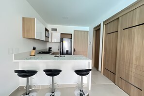 Fridge, oven, coffee/tea maker, cookware/dishes/utensils