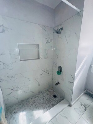Shower, hair dryer, towels, toilet paper