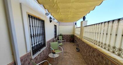 Come and stay in Marifé's house, two bedrooms available at 17 km from Seville.