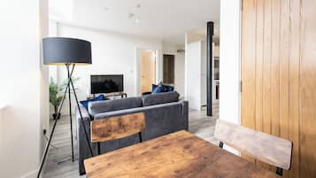 Apartment, 1 King Bed with Sofa bed | Living area | Flat-screen TV