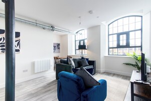 Apartment, 1 King Bed with Sofa bed | Living area | Flat-screen TV