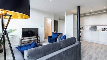 Apartment, 1 King Bed with Sofa bed | Living area | Flat-screen TV