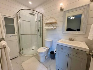 Shower, towels, soap, toilet paper