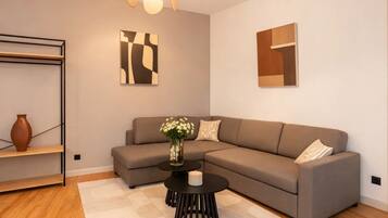 Superior Apartment, Courtyard View | Living area | 80-cm plasma TV with digital channels