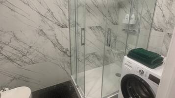 Shower, hair dryer, towels, soap
