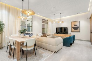 Deluxe Apartment, Balcony | Living area